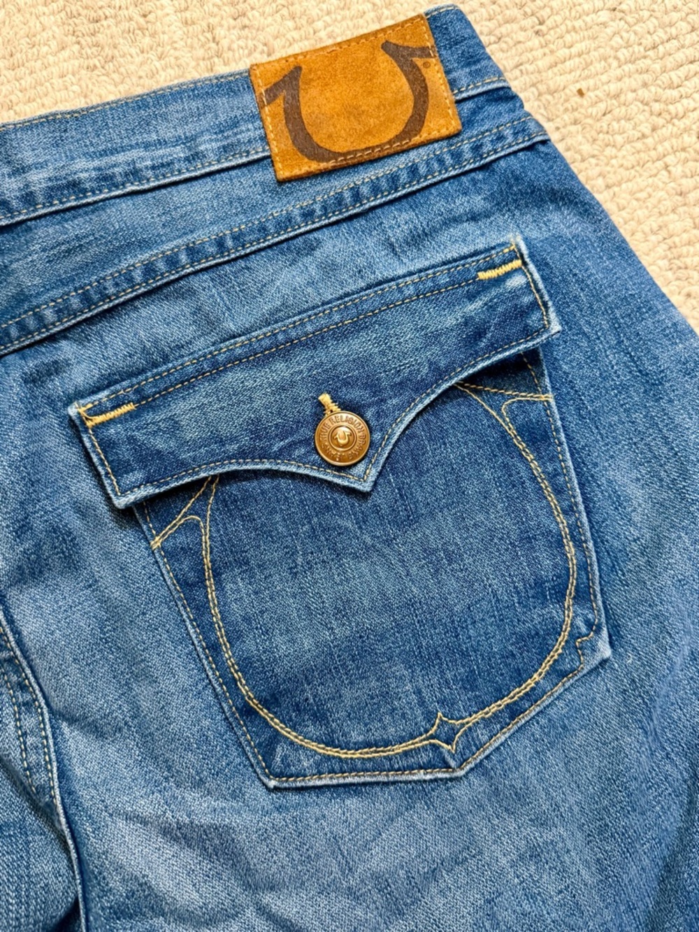 True Religion Blue Denim Cropped Jeans with Tan Leather Patch